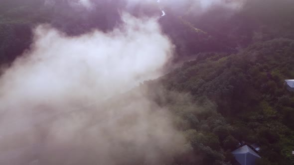 Clouds above the road and river valley