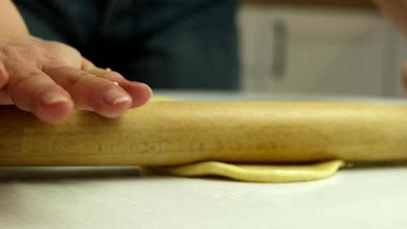 Rolling Pin Dough at Kitchen Table