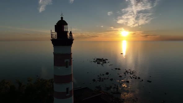 Aerial View of a Beautiful Sunrise or Sunset Behind the Dome and the Light of the Lighthouse of the