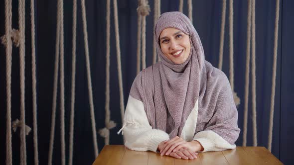 Adult Beautiful Muslim Woman with Hijab on Head Smiling for Camera in Room