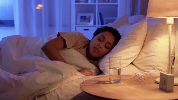 Woman Awaking at Night and Drinking Water