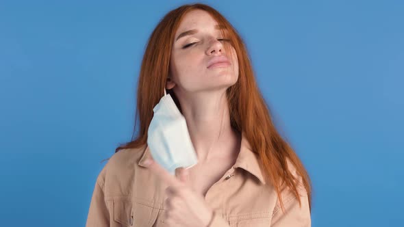 Redhaired Female in Beige Jacket