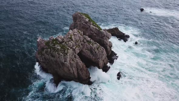 Aerial View of Reefs and Cliffs After Dawn on Arnia Beach. Northern Spain in Summer