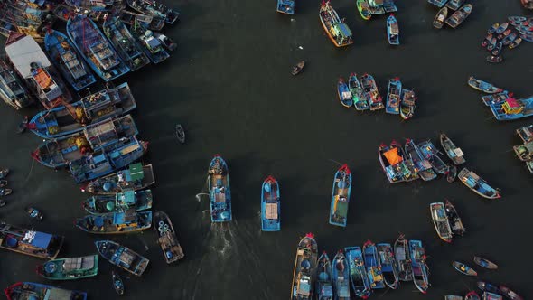 Overfishing Vietnamese harbor with endless boat number, aerial top down view