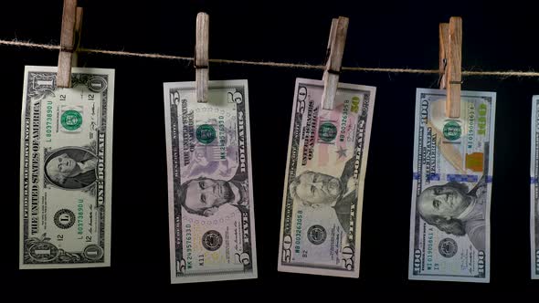 Dollars Dry on a Clothespin Rope