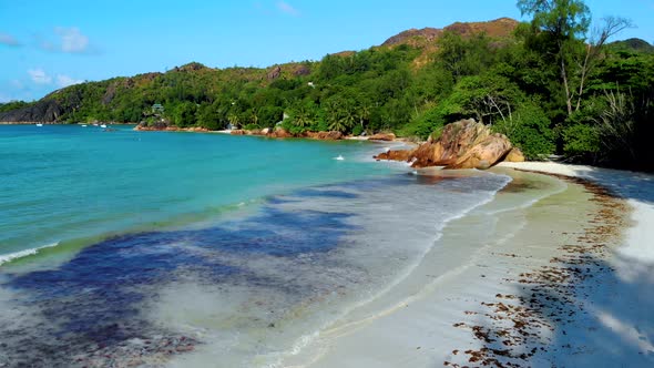 Anse Patates La Digue Seychelles Young Couple Men and Woman on a Tropical Beach During a Luxury