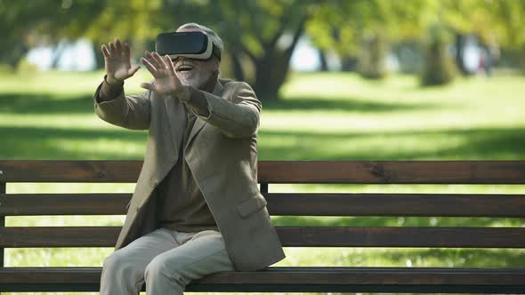 Amazed Senior Men Using VR Headset Outdoors, Modern Technologies Experience