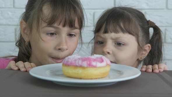 Take a doughnut. A view of a glaze doughnut on the plate.