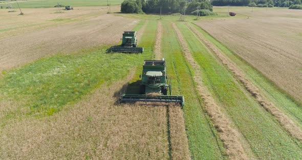 Combine Harvester on Wheat Field