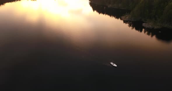 A fishing boat doing sunset shot from a drone.