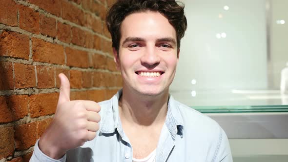 Thumbs Up by Young Man
