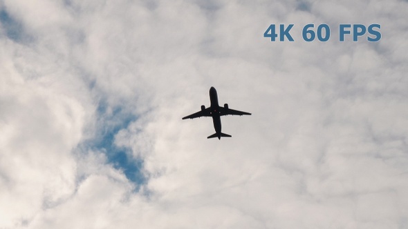 Airplane Takes Off Against Background Of Clouds