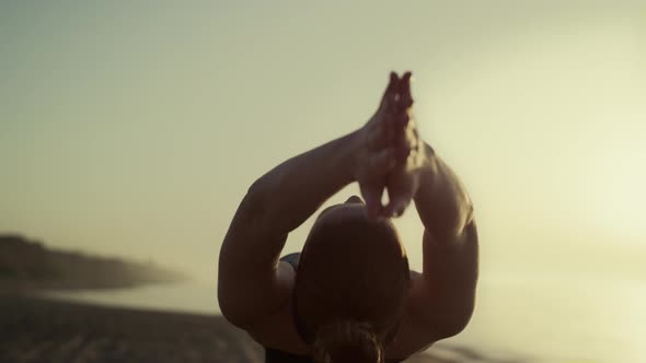 Sport Girl Raise Hands Up Tilting Body Back at Sunset