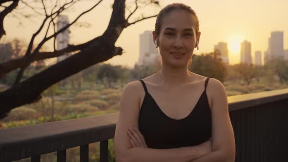 Girl in sportswear smile, and look at camera after running workout for health in evening.