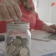 Mujer gestiona cuentas y ahorra monedas de dos euros en un hucha - VideoHive Item for Sale