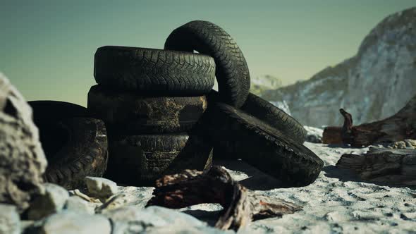 Old Tire on the Seashore and Pollution of Nature