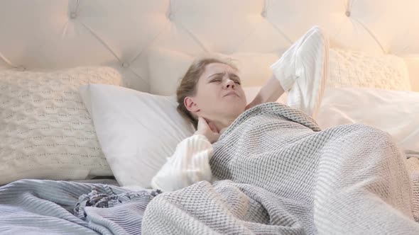 Uncomfortable Sleeping Woman with Neck Pain in Bed