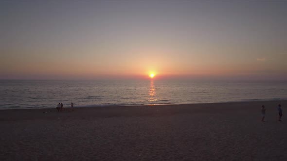 Aerial view of a sandy beach at sunset in Kathisma, Lefkas island, Greece.