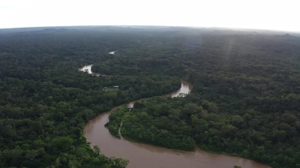 Aerial view of a tropical river meandering through a tropical forest