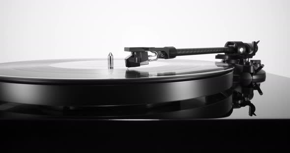 Pullout with Black Turntable with Spinning Vinyl Record on