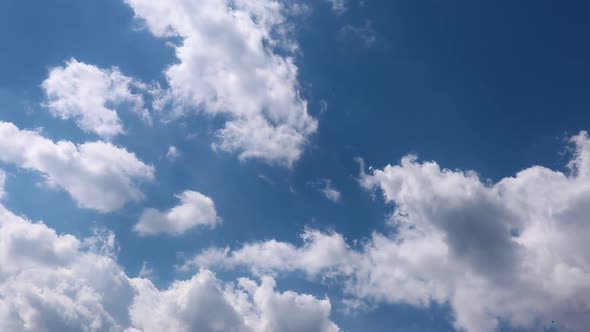 Timelapse summer clouds on blue sky