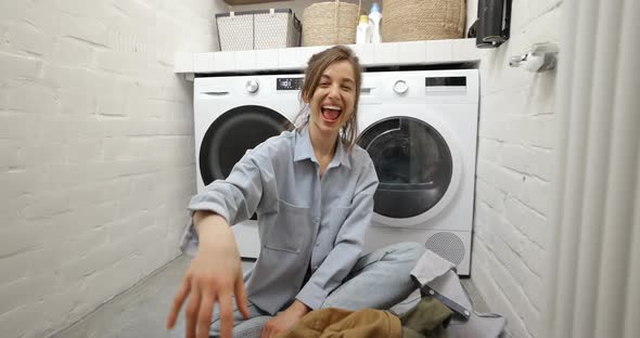 Housewife Throwing Clothes at the Laundry