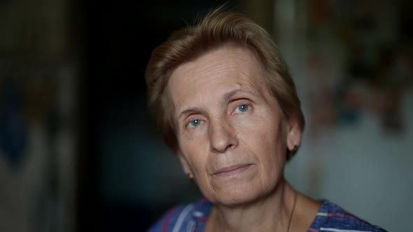 Charming Retiree Woman Portrait in Apartment with Natural Light Closeup of Face with Age Changes