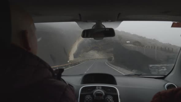 A Slowmotion View From a Windshield of a Car Moving Past the Volcanic Rock