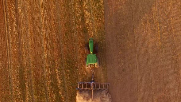 Tractor Ploughing Field, Top View.