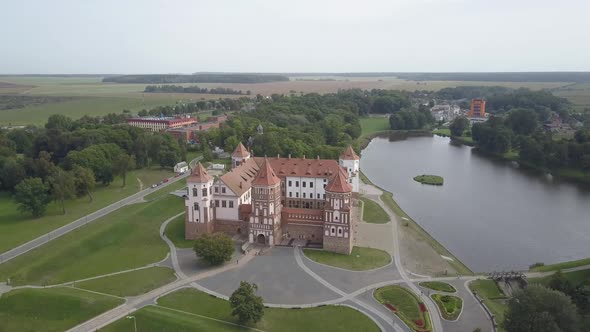 Masterpiece of Architecture of Belarus - Mir Castle Among Lakes and Parks, Aerial View. Flying Over