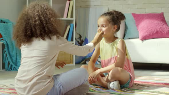Little Girls Learning Makeup Together alt