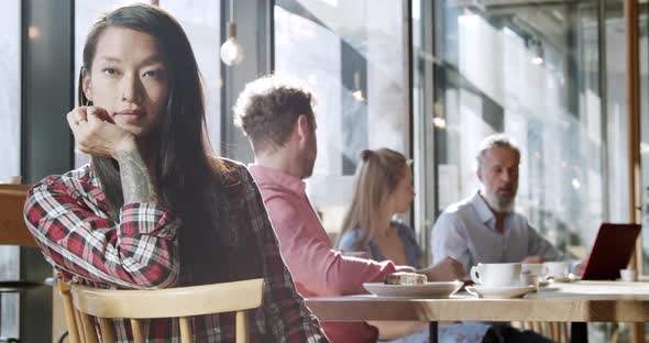 Portrait of businesswoman having a meeting with colleagues at a cafe