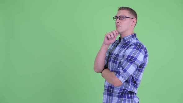 Profile View of Happy Young Hipster Man Thinking