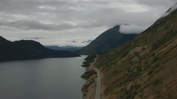 Beautiful View of Scenic Road Alongside Peaceful Lake