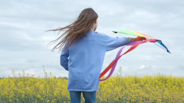 A child plays with a kite. 