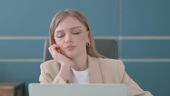 Close Up of Businesswoman Sleeping While Sitting in Office