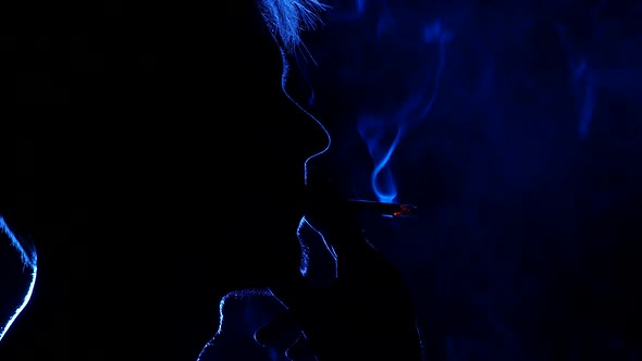 Portrait of a Bearded Man with a Cigarette, Back Light, Silhouette