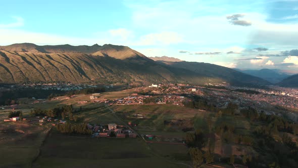 4k aerial drone footage over the Northern hills and mountains of Cusco in Peru at sunset. Dolly in w