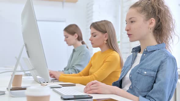 Cheerful Creative Female Designer Doing Video Chat on Desktop