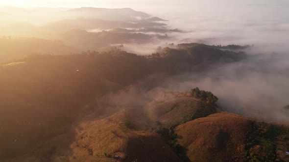 4K Aerial Flying Above Sea of Fog at Sunrise