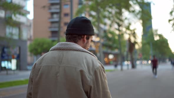 Handsome man wearing hat walking