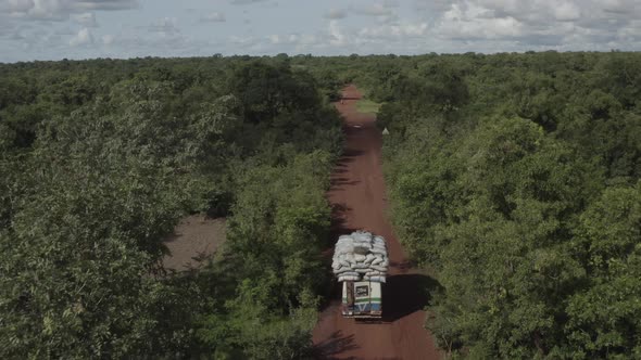 Africa Mali Forest And Road Chasing Loaded Truck Aerial View