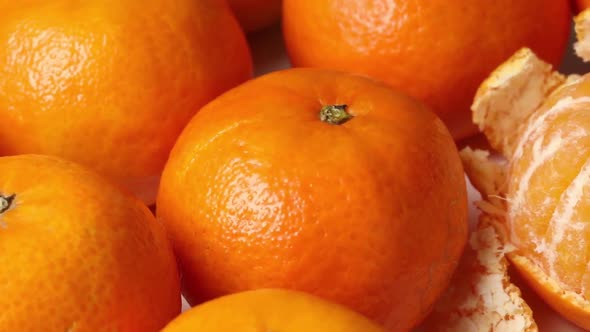  Fresh whole and peeled mandarin close up 