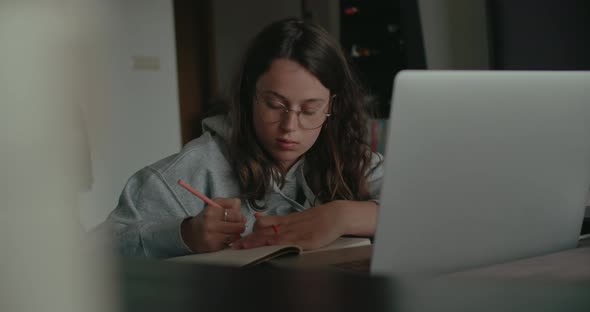 Millennial Woman at Home Work on Project or Study