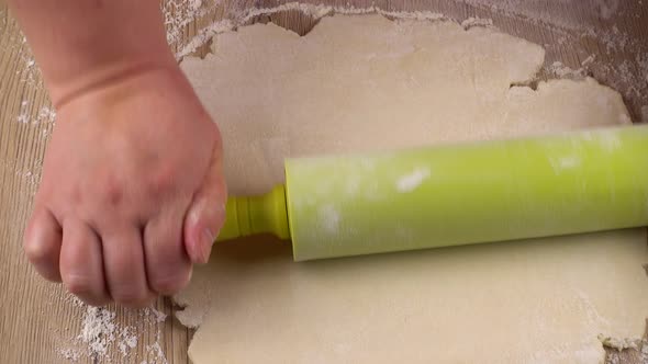 The process of making cookies from shortbread dough.