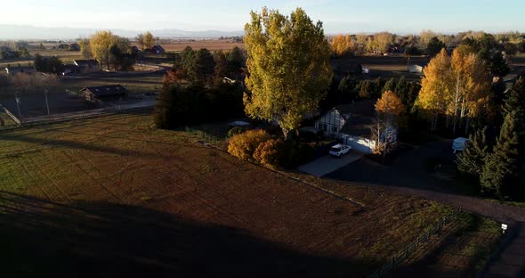 Drop drone shot near Fort Collins Colorado showing beautiful farm property