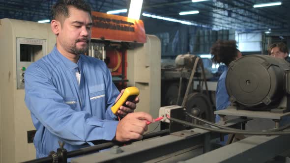 Engineer teams inspect machines' electric current at the industry factory.