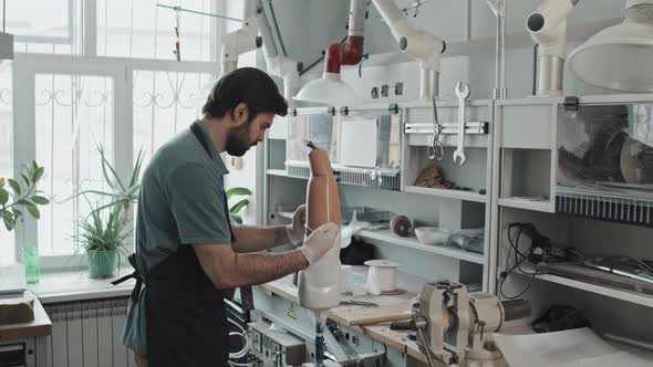 Applying Liquid Plastic On Plaster Cast