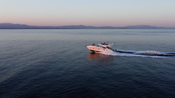 Fast moving motor yacht at the sea.