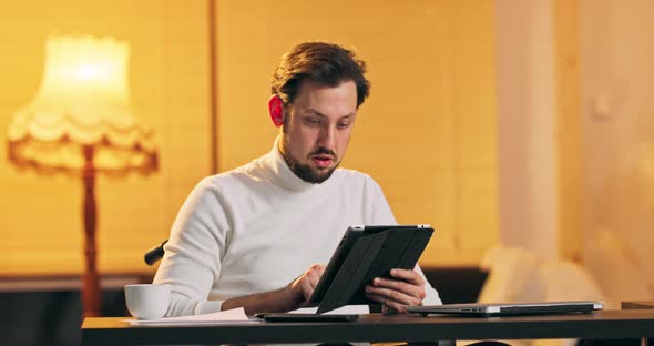 Portrait of Casual Businessman in Wheelchair Using Tablet in the Office